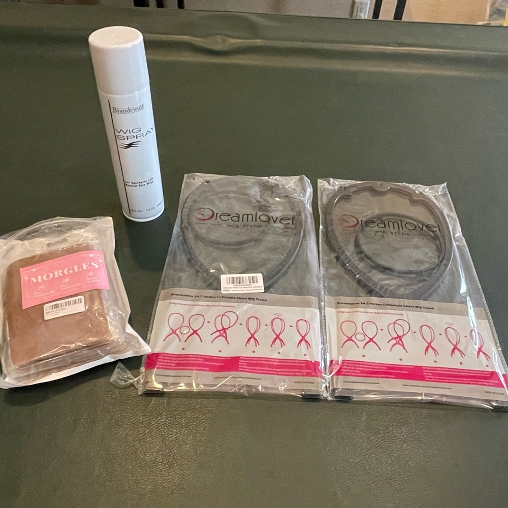 2 wig stands, 1 wig spray, 9 nude skull under wig caps.
